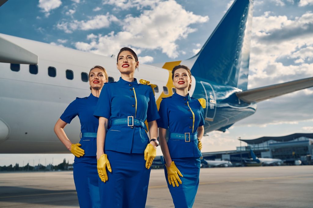 Illustrative photograph of cabin crew beside an aircraft