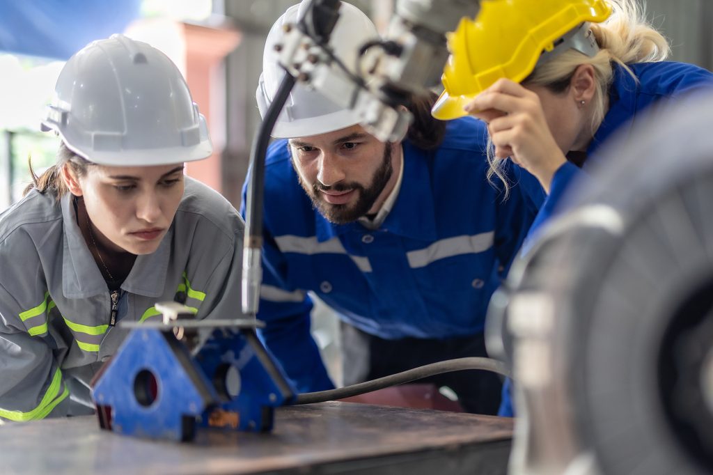Technicians working with industrial equipment